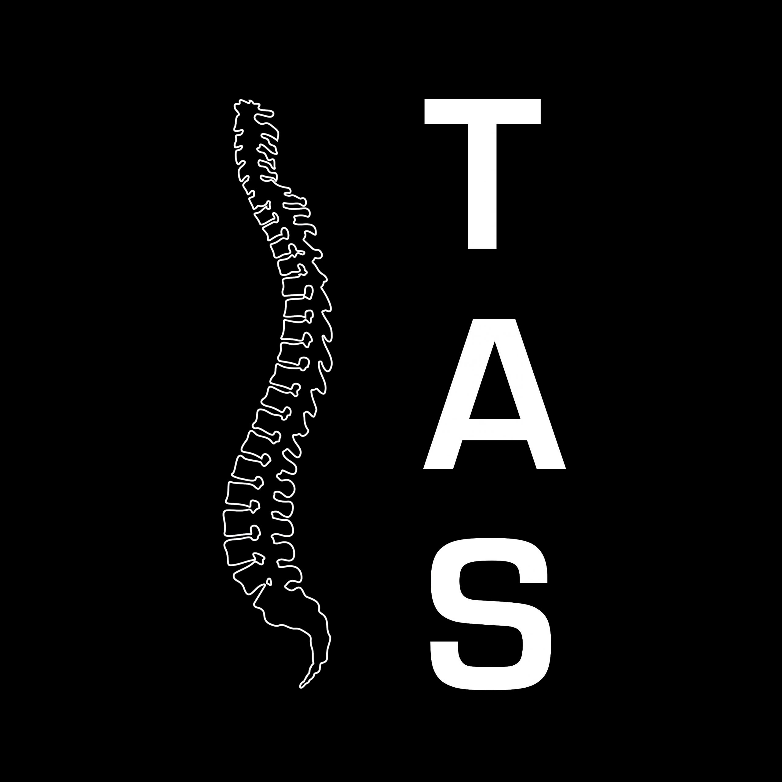 Das Bild zeigt das TAS Logo. Auf der linken Bildseite ist eine weiße Wirbelsäule zusehen. Auf der rechten Bildseite steht vertikal in weiß TAS geschrieben.